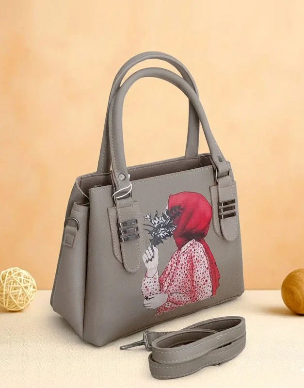 Gray faux-leather crossbody bag with unique Hijabi Girl print and gold twist-lock closure
