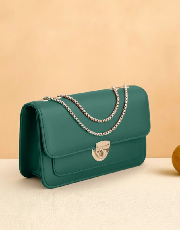Rich green PU leather crossbody bag with gold twist-lock and detachable strap